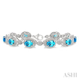 7X5 MM Oval Shape Blue Topaz and 1/10 Ctw Round Cut Diamond Semi-Precious Bracelet in Sterling Silver