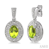 7x5 MM Oval Cut Peridot and 1/20 ctw Single Cut Diamond Earrings in Sterling Silver