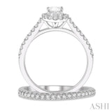 7/8 Ctw Diamond Wedding Set With 3/4 Ctw Oval Cut Engagement Ring and 1/6 Ctw Wedding Band in 14K White Gold