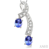 5x4MM Oval Cut Tanzanite and 1/6 Ctw Round Cut Diamond Pendant in 14K White Gold with Chain