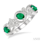 1/20 ctw Entwined Open Lattice 4x3MM Oval Cut Emerald and Round Cut Diamond Precious Wedding Band in 14K White Gold